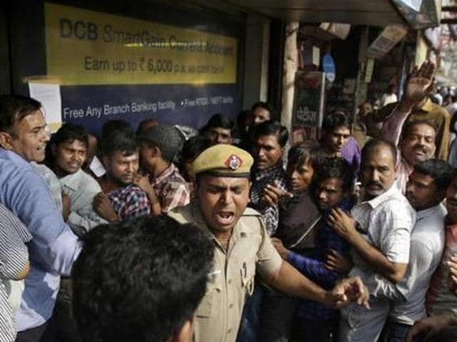 Cash-strapped people were seen waiting in frustration as most of the cash dispensing machines ran out of cash within hours after being stocked, while thousands of ATMs are still not functional.(AP Photo)