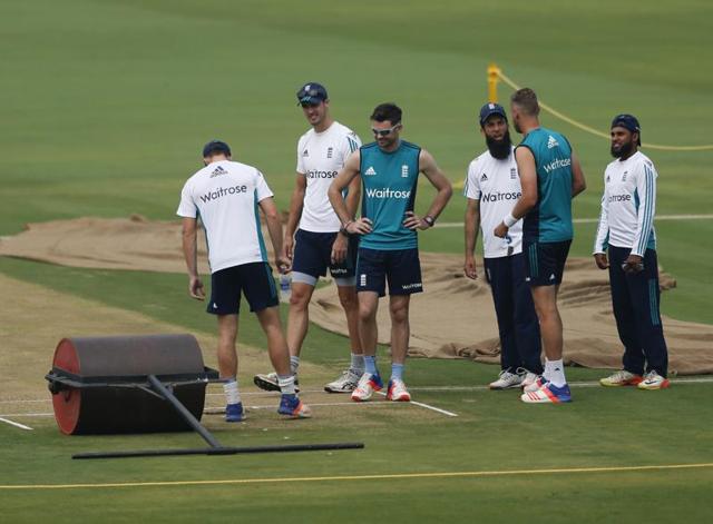 Members of England cricket team inspect the pitch. (AP)