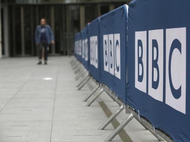 File photo of a pedestrian walking past a BBC logo at Broadcasting House in central London. (Reuters) File photo of a pedestrian walking past a BBC logo at Broadcasting House in central London. (Reuters)