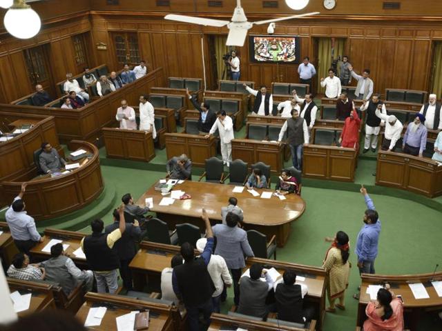AAP MLAs shout slogans against Prime Minister Narendra Modi during the special session of Vidhan Sabha on black money in New Delhi on Tuesday. (Mohd Zakir/Hindustan Times) AAP MLAs shout slogans against Prime Minister Narendra Modi during the special session of Vidhan Sabha on black money in New Delhi on Tuesday. (Mohd Zakir/Hindustan Times)