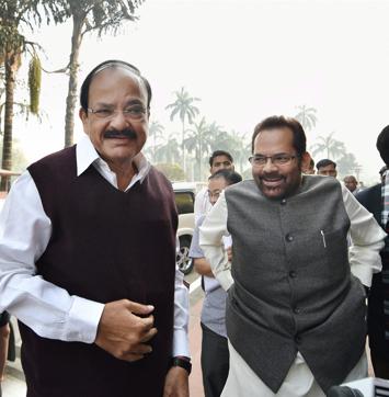 Union information and broadcasting minister M Venkaiah Naidu and MoS Mukhtar Abbas Naqvi at Parliament on the opening day of the winter session, in New Delhi.(PTI)