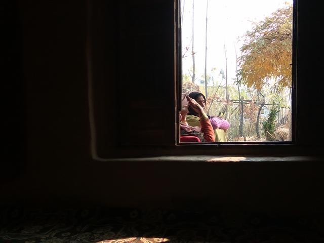 Danish’s mother and grandmother wailing in the balcony of their house despite the cold weather.  (Vijdan Mohammad Kawoosa)