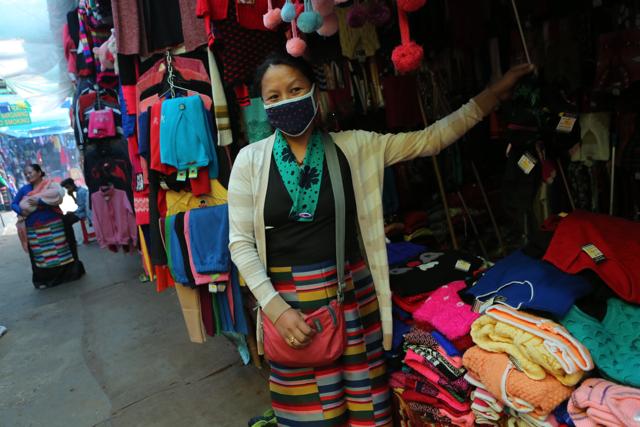 Kalsang Dolma, from Dharamsala, sells anti-pollution mask, starting Rs 20. (Manoj Verma/HT Photo )