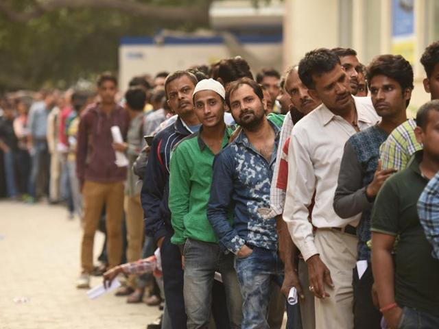 Many skip their offices to stand in long queues to exchange their old Rs 500 and 1000 notes and withdraw cash from the ATM . (PTI Photo) Many skip their offices to stand in long queues to exchange their old Rs 500 and 1000 notes and withdraw cash from the ATM . (PTI Photo)