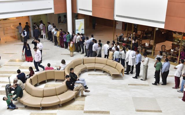 People stand in a queue to withdraw money from an ATM at Fortis Hospital, Gurgaon. (Sanjeev Verma/HT Photo) People stand in a queue to withdraw money from an ATM at Fortis Hospital, Gurgaon. (Sanjeev Verma/HT Photo)
