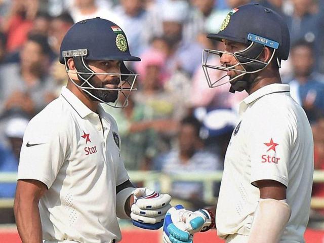 Virat Kohli and batsman Cheteshwar Pujara during the Day 1 of the 2nd Test cricket match. (PTI photo) Virat Kohli and batsman Cheteshwar Pujara during the Day 1 of the 2nd Test cricket match. (PTI photo)