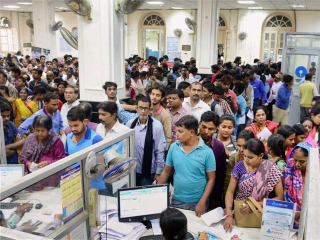 People stand in queues to withdraw money and exchange old currency notes in a bank in Allahabad on Wednesday. (PTI Photo) People stand in queues to withdraw money and exchange old currency notes in a bank in Allahabad on Wednesday. (PTI Photo)