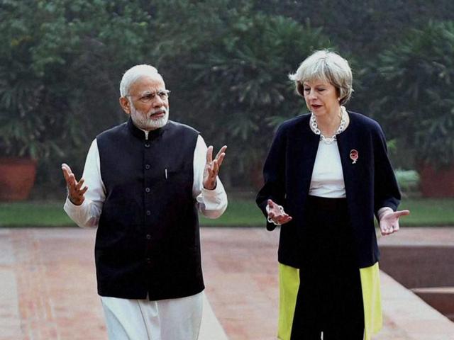 Britain's Prime Minister Theresa May (L) reads a joint statement as her Indian counterpart Narendra Modi watches at Hyderabad House in New Delhi on November 7, 2016. (REUTERS) Britain's Prime Minister Theresa May (L) reads a joint statement as her Indian counterpart Narendra Modi watches at Hyderabad House in New Delhi on November 7, 2016. (REUTERS)