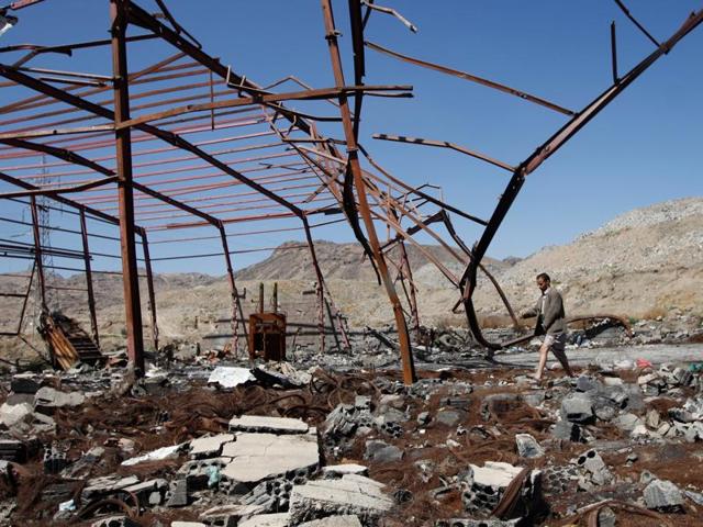 A man walks outside at a waste recycling factory which has been recently hit by Saudi-led air strikes on the outskirts of Sanaa, Yemen. (REUTERS) A man walks outside at a waste recycling factory which has been recently hit by Saudi-led air strikes on the outskirts of Sanaa, Yemen. (REUTERS)