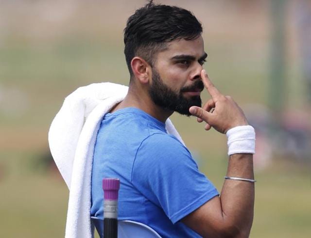 Virat Kohli curbed his natural instinct in Rajkot to force a draw against England. (REUTERS) Virat Kohli curbed his natural instinct in Rajkot to force a draw against England. (REUTERS)