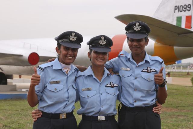 The first three women fighter pilots of the Indian Air Force --- (from left) Mohana Singh, Avani Chaturvedi and Bhawana Kanth --- pose for photographs after the graduation parade at the Indian Air Force academy in Dundigal, on the outskirts of Hyderabad, in June 2016.(AP)