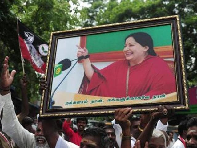 Members of the AIADMK party carry placards with the image of party leader Jayalalithaa. (AFP File Photo) Members of the AIADMK party carry placards with the image of party leader Jayalalithaa. (AFP File Photo)