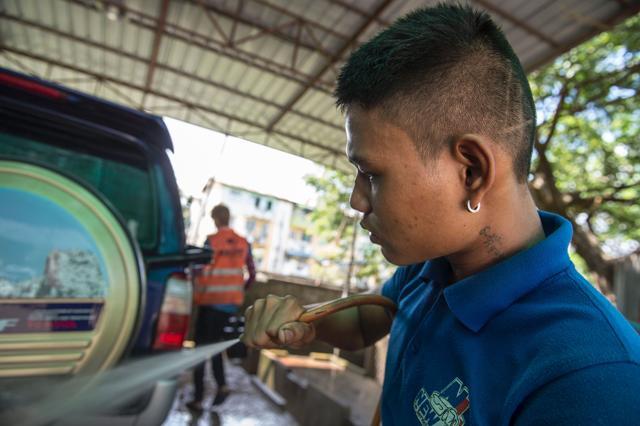 Former Myanmar child soldier, 21-year-old Su Thet Htoo, cleans a car at a repair shop in Yangon. In major cities such as Yangon and Mandalay, recruiters are known to scour parks, pagodas and bus and railway stations for poor and vulnerable boys who they threaten, drug or tempt with promises of well-paying jobs. (AFP) Former Myanmar child soldier, 21-year-old Su Thet Htoo, cleans a car at a repair shop in Yangon. In major cities such as Yangon and Mandalay, recruiters are known to scour parks, pagodas and bus and railway stations for poor and vulnerable boys who they threaten, drug or tempt with promises of well-paying jobs. (AFP)