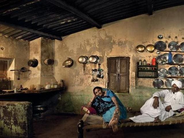 Sarpanch’s Home, Karan Ismailpura, Gujarat. Champaben Prajapati is Ismailpur’s first woman pradhan. Her posture in this photograph seems to reflect the confidence her council position provides. Champaben’s husband Hargovan, since deceased, was a farmer and vice pradhan of the panchayat. The multitude of steel utensils lining their walls testify to the family’s relative prosperity. (Amit Pasricha) Sarpanch’s Home, Karan Ismailpura, Gujarat. Champaben Prajapati is Ismailpur’s first woman pradhan. Her posture in this photograph seems to reflect the confidence her council position provides. Champaben’s husband Hargovan, since deceased, was a farmer and vice pradhan of the panchayat. The multitude of steel utensils lining their walls testify to the family’s relative prosperity. (Amit Pasricha)