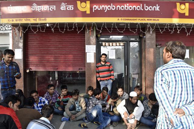 Moments before madness (8.30am): People line up before the shutters open. (Saumya Khandelwal/HT Photo) Moments before madness (8.30am): People line up before the shutters open. (Saumya Khandelwal/HT Photo)