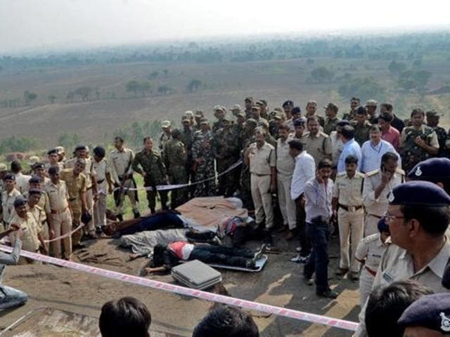 Police officers and Special Task Force soldiers stand beside the bodies of suspected SIMI members, on the outskirts of Bhopal.(Reuters File Photo) Police officers and Special Task Force soldiers stand beside the bodies of suspected SIMI members, on the outskirts of Bhopal.(Reuters File Photo)