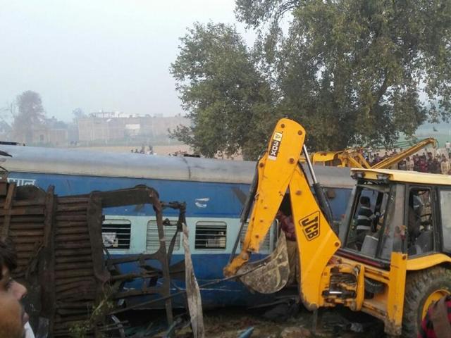 JCBs have been pressed into service to detach the tangled coaches. (HT Photo)