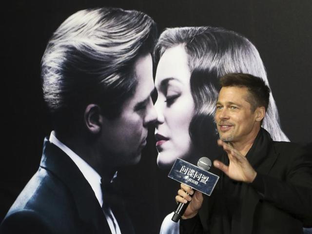 Actor Brad Pitt gestures to his fans as he attends a premiere of director Robert Zemeckis' new film Allied in Shanghai. (AP) Actor Brad Pitt gestures to his fans as he attends a premiere of director Robert Zemeckis' new film Allied in Shanghai. (AP)