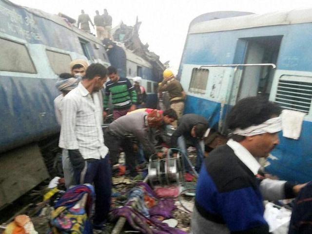 Rescue officials cut the tangled coaches with gas cutters. (PTI Photo)