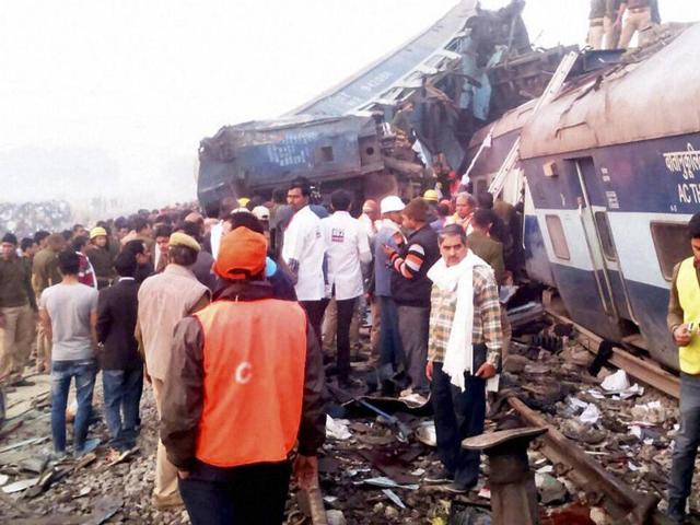 Rescue officials and locals on the site where the Indore-Patna Express was derailed. (PTI photo)