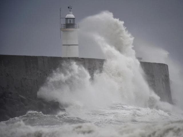 Waves crash against the harbour wall as Storm Angus passes western France and southern England . (Reuters) Waves crash against the harbour wall as Storm Angus passes western France and southern England . (Reuters)