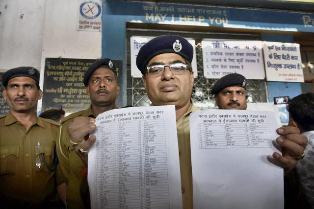A GRP officer shows the casualty list of the Indore-Patna Express train. (PTI Photo) A GRP officer shows the casualty list of the Indore-Patna Express train. (PTI Photo)