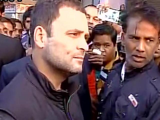 Rahul Gandhi talks to people outside an ATM in Delhi’s Anand Parbat on Monday morning.(ANI Photo)