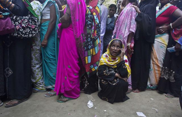A woman talks on her mobile phone as she waits outside a bank to exchange or deposit discontinued currency notes near Guwahati. Fatalist acceptance of the given on the one hand contrasts with the anti-fatalist urge for change in India, writes Gopalkrishna Gandhi. (AP) A woman talks on her mobile phone as she waits outside a bank to exchange or deposit discontinued currency notes near Guwahati. Fatalist acceptance of the given on the one hand contrasts with the anti-fatalist urge for change in India, writes Gopalkrishna Gandhi. (AP)