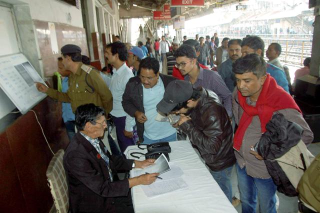 Relatives of passengers in the Indore-Patna Express train which derailed on Sunday, taking a look at the passenger manifesto at Bhopal railway station. (PTI) Relatives of passengers in the Indore-Patna Express train which derailed on Sunday, taking a look at the passenger manifesto at Bhopal railway station. (PTI)