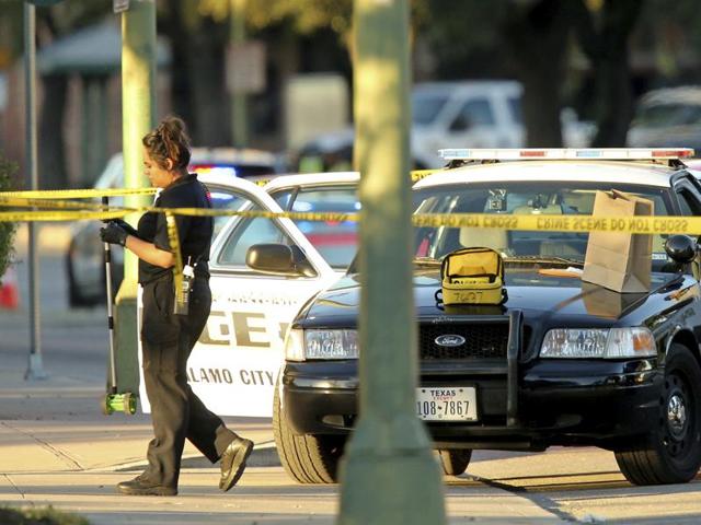 San Antonio Police Department personnel investigate the scene after Det. Benjamin Marconi was fatally shot Sunday, Nov. 20, 2016, in San Antonio. (AP Photo) San Antonio Police Department personnel investigate the scene after Det. Benjamin Marconi was fatally shot Sunday, Nov. 20, 2016, in San Antonio. (AP Photo)