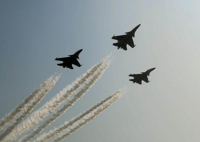 IAF's Sukhoi planes making fly by manoeuvre in the sky. (PTI) IAF's Sukhoi planes making fly by manoeuvre in the sky. (PTI)