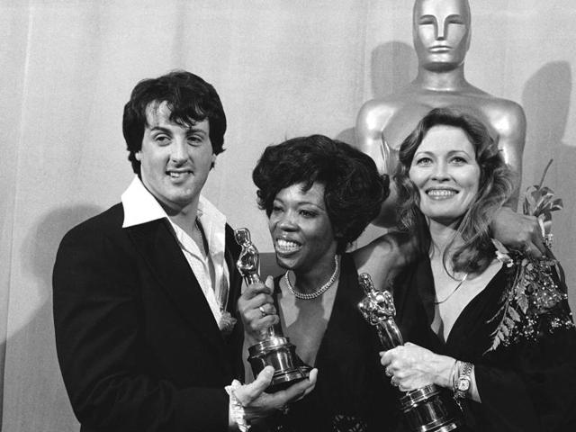 Clicked in March 28, 1977, this photo shows Sylvester Stallone with Eletha Finch and Faye Dunaway at the Academy Awards in Los Angeles. Rocky was among the winners that year. (AP Photo) Clicked in March 28, 1977, this photo shows Sylvester Stallone with Eletha Finch and Faye Dunaway at the Academy Awards in Los Angeles. Rocky was among the winners that year. (AP Photo)