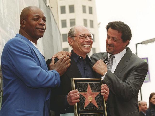 Sylvester Stallone and his Rocky co-star Carl Weathers pose with producer Irwin Winkler at the Walk of Fame ceremony for Winkler in the Hollywood section of Los Angeles. (AP Photo) Sylvester Stallone and his Rocky co-star Carl Weathers pose with producer Irwin Winkler at the Walk of Fame ceremony for Winkler in the Hollywood section of Los Angeles. (AP Photo)