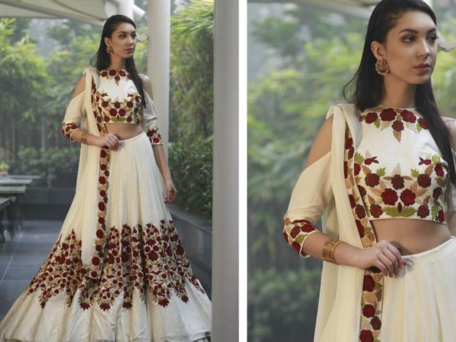 Model Rafaela Andrade wearing this stunning white lehenga with floral motifs teamed with the 60’s favourite cold-shoulder blouse. (photos: Waseem Gashroo/HT) Model Rafaela Andrade wearing this stunning white lehenga with floral motifs teamed with the 60’s favourite cold-shoulder blouse. (photos: Waseem Gashroo/HT)