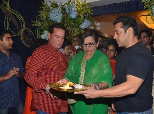 Screenwriter Salim Khan along with his son Salman Khan and wife Helen participates in a procession for the immersion of an idol of Lord Ganesh in a file photo from September 18, 2015. (IANS)