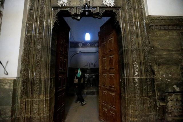A fighter from the ‘Kataeb Babylon’, a group of Christian fighters who fight alongside the Hashd Shabi, Shia fighters, inspects the Mar Behnam monastery after the town was recaptured from the Islamic State. (Reuters) A fighter from the ‘Kataeb Babylon’, a group of Christian fighters who fight alongside the Hashd Shabi, Shia fighters, inspects the Mar Behnam monastery after the town was recaptured from the Islamic State. (Reuters)