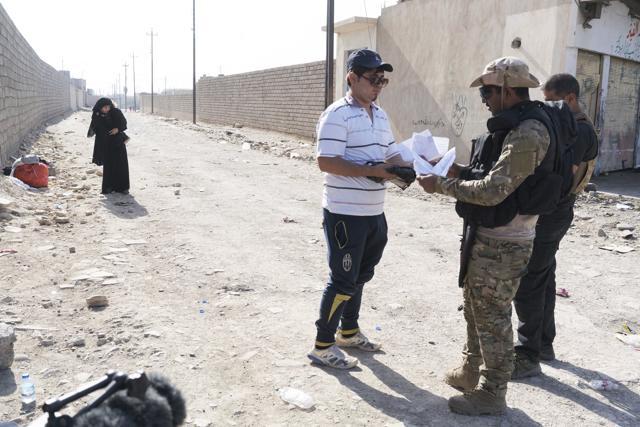 Omar Danoun has his papers checked and is taken into custody by Iraqi soldiers at a collection point for displaced Iraqis in Gogjali, Iraq. (AP Photo) Omar Danoun has his papers checked and is taken into custody by Iraqi soldiers at a collection point for displaced Iraqis in Gogjali, Iraq. (AP Photo)
