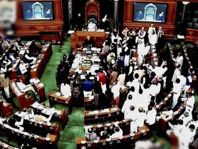 Opposition members protest in the well of Lok Sabha during the winter session of Parliament in New Delhi on November 18, 2016. (PTI) Opposition members protest in the well of Lok Sabha during the winter session of Parliament in New Delhi on November 18, 2016. (PTI)