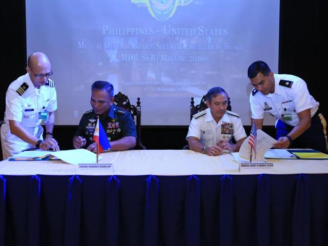 US Pacific command chief Admiral Harry Harris (centre) walks with Philippine military chief Ricardo Visaya after the Philippine-US Mutual Defense Board meeting in Manila on November 22, 2016. (AFP) US Pacific command chief Admiral Harry Harris (centre) walks with Philippine military chief Ricardo Visaya after the Philippine-US Mutual Defense Board meeting in Manila on November 22, 2016. (AFP)