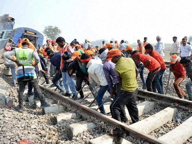 Relief work in progress at the site of accident where Patna-Indore Express train derailed near Pukhrayan village in Kanpur on Monday.(PTI) Relief work in progress at the site of accident where Patna-Indore Express train derailed near Pukhrayan village in Kanpur on Monday.(PTI)