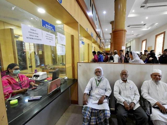 Senior citizens in a queue at a bank to exchange old notes at SBI bank in Hyderabad on Saturday. (PTI Photo)