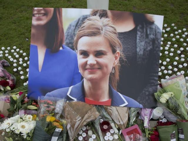 FILE - This is a Friday, June 17, 2016, file photo of an image and floral tributes for Jo Cox, in Parliament Square, outside the House of Parliament in London, after the 41-year-old British Member of Parliament was fatally injured in northern England. A jury Wednesday Nov. 23, 2016 found Thomas Mair with white supremacist views guilty of murdering Labour lawmaker Jo Cox a week before Britain's EU membership referendum. (AP Photo/Matt Dunham, File) (AP) FILE - This is a Friday, June 17, 2016, file photo of an image and floral tributes for Jo Cox, in Parliament Square, outside the House of Parliament in London, after the 41-year-old British Member of Parliament was fatally injured in northern England. A jury Wednesday Nov. 23, 2016 found Thomas Mair with white supremacist views guilty of murdering Labour lawmaker Jo Cox a week before Britain's EU membership referendum. (AP Photo/Matt Dunham, File) (AP)