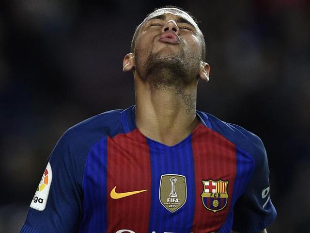 Brazil and FC Barcelona striker Neymar is accused of, along with several accomplices, having concealed a portion of the cost of his multi-million-dollar transfer from Santos to Barca in 2013.(AFP)