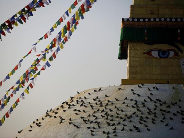 Pigeons rest on the dome of Nepal’s Boudhanath stupa, as the country celebrates the official completion of restoration work on the historic site, which was damaged in the country’s 2015 earthquake.  (REUTERS) 