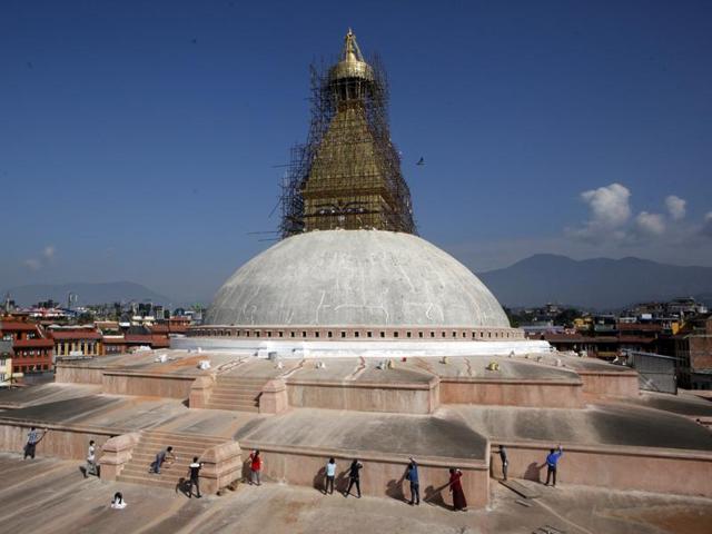 Nepalese volunteers work at the reconstruction site of stupa . It sits on the ancient trade route from Tibet to Kathmandu valley. (AP) 