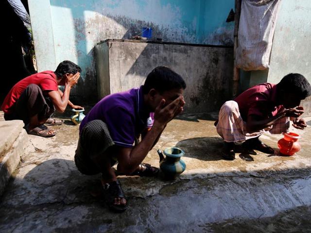 Rohingya Muslim perform ablution before prayer at the unregistered Rohingya Refugee Camp Leda in Teknaf near Cox’s Bazar, Bangladesh on Tuesday (Reuters)