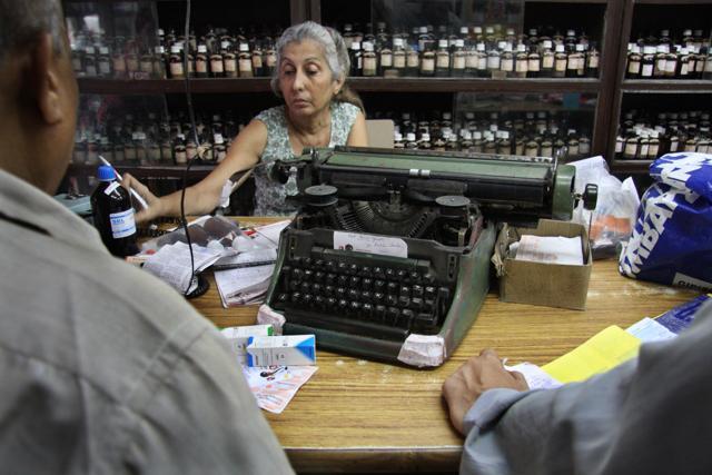 Mahrukh Calagopi uses a typewriter to label vials at Parsi Homeopathic Pharmacy, Dhobi Talao (Photo: Chirodeep Chaudhuri )