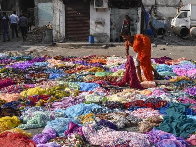 A women dries the clothes at Sai Baba Nagar at Dhobi Ghat. (KUNAL PATIL/HT PHOTO) 