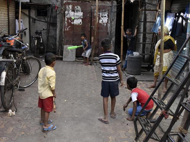Kids enjoy a game of cricket at Sane Guruji Nagar, before moving out. (KUNAL PATIL/HT PHOTO) 