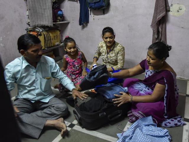 Ramesh Laxman Dadavkar packs his belongings items as he prepares to vacate his house. (KUNAL PATIL/HT PHOTO) 